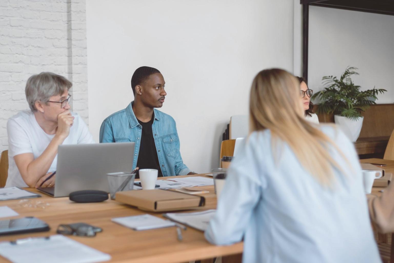 Financial planning workspace with documents and laptop